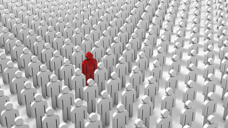 A crowd of identical gray figures with one figure in red standing out in the center.